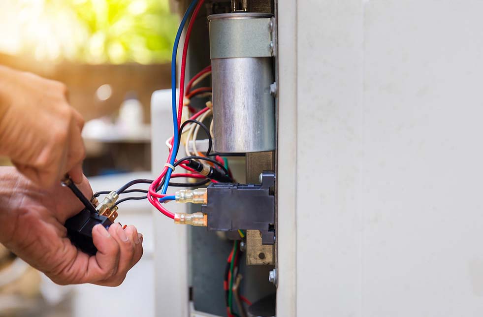 Air conditioner being repaired